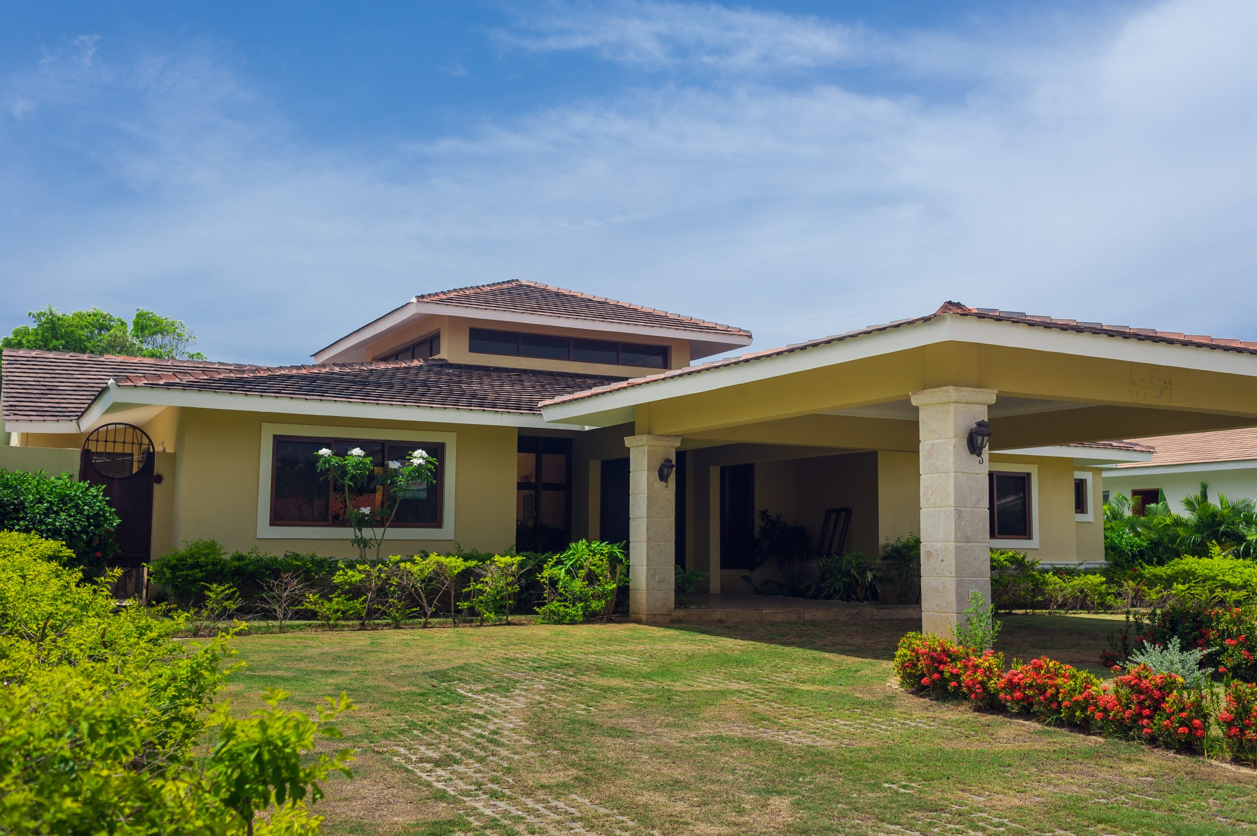 Luxurious villa in Dominican Republic. Beautiful villa with an own swimming pool. villa on luxury Caribbean resort with beautiful garden. Classical spanish villa among flowers, not far from ocean. Luxurious villa in Dominican Republic. Beautiful villa with an own swimming pool. villa on luxury Caribbean resort with beautiful garden. Classical spanish villa among flowers, not far from ocean.